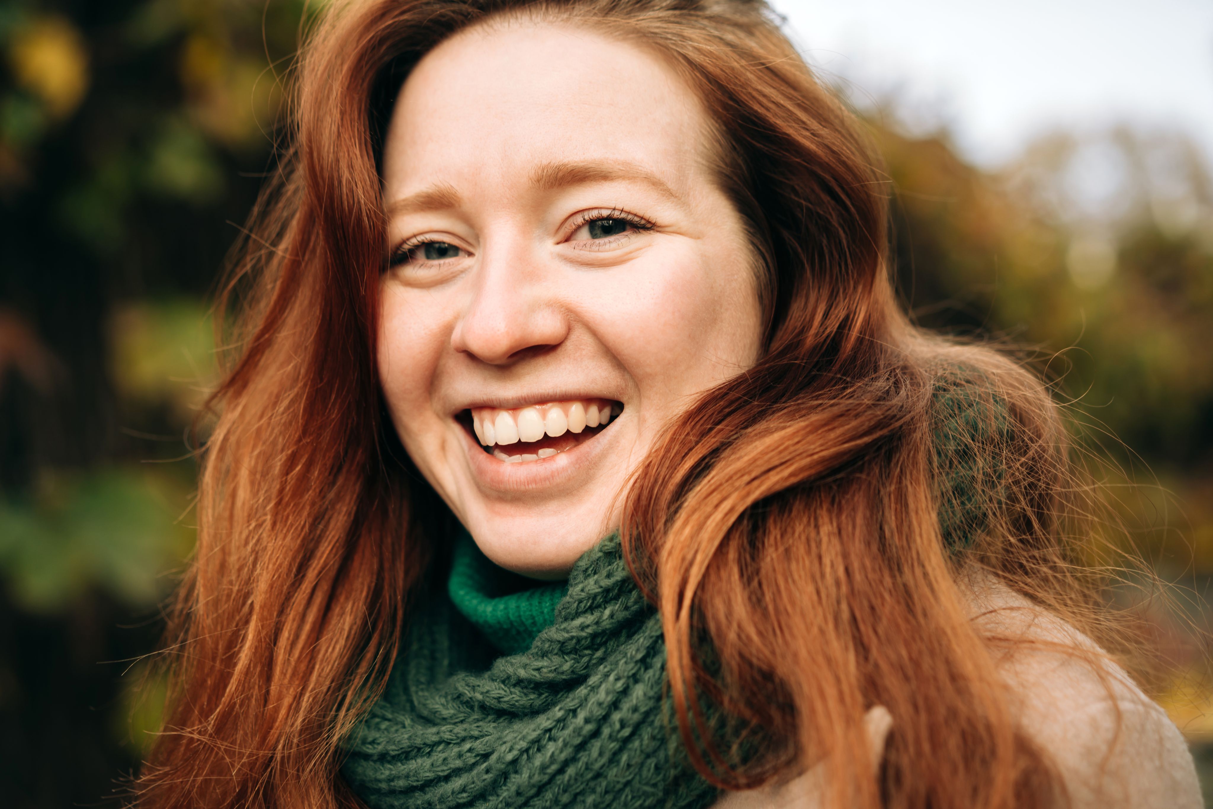 woman holding man and toddler hands during daytime